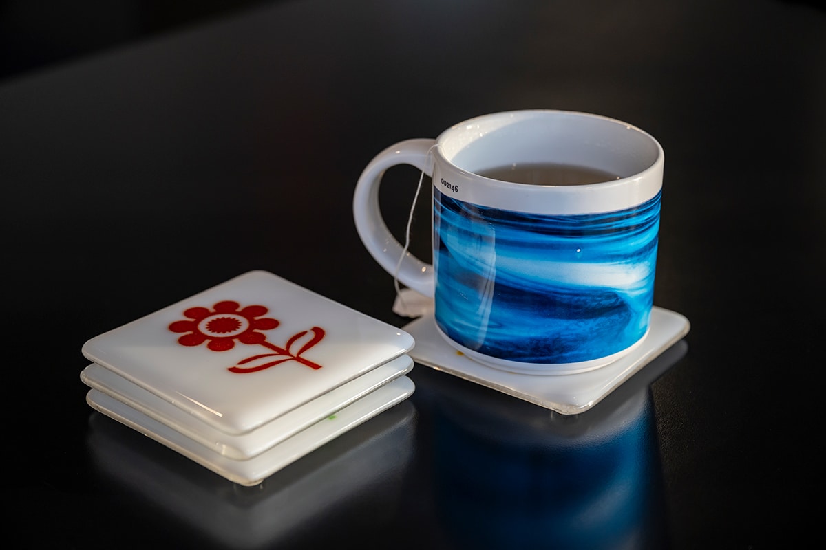 Coffee Mug with Infinite Image Factory coasters