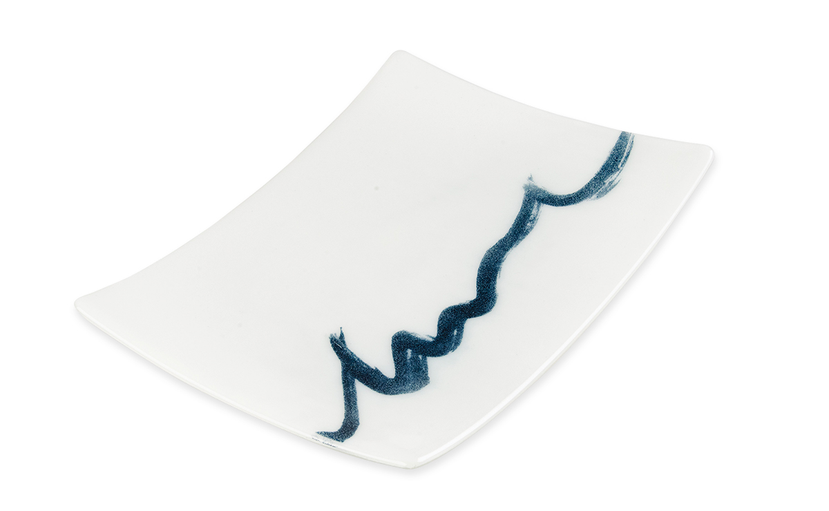 Inky blue brush strokes on a plate