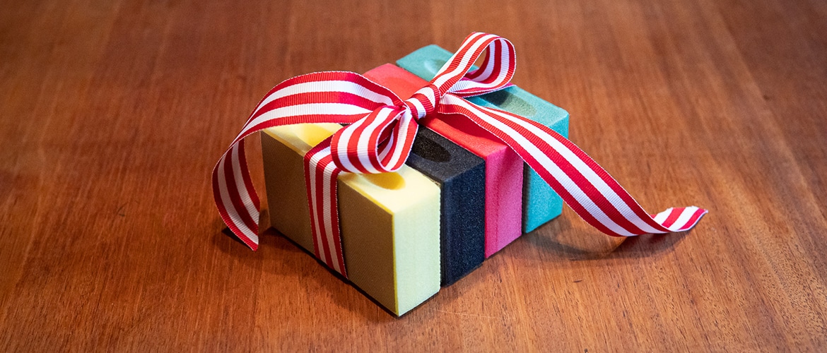 Bundle of sanding pads tied with a bow
